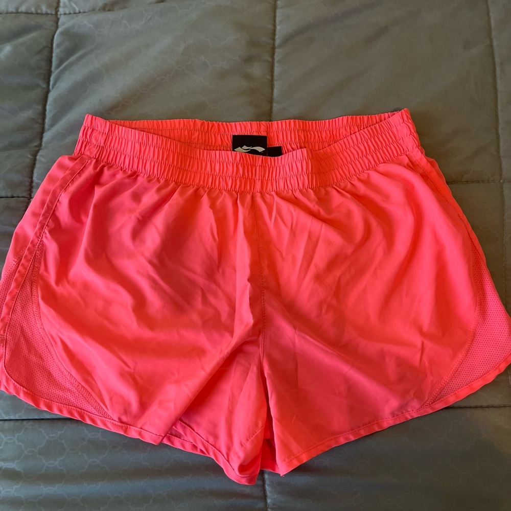 Gently used neon pink short shorts.
